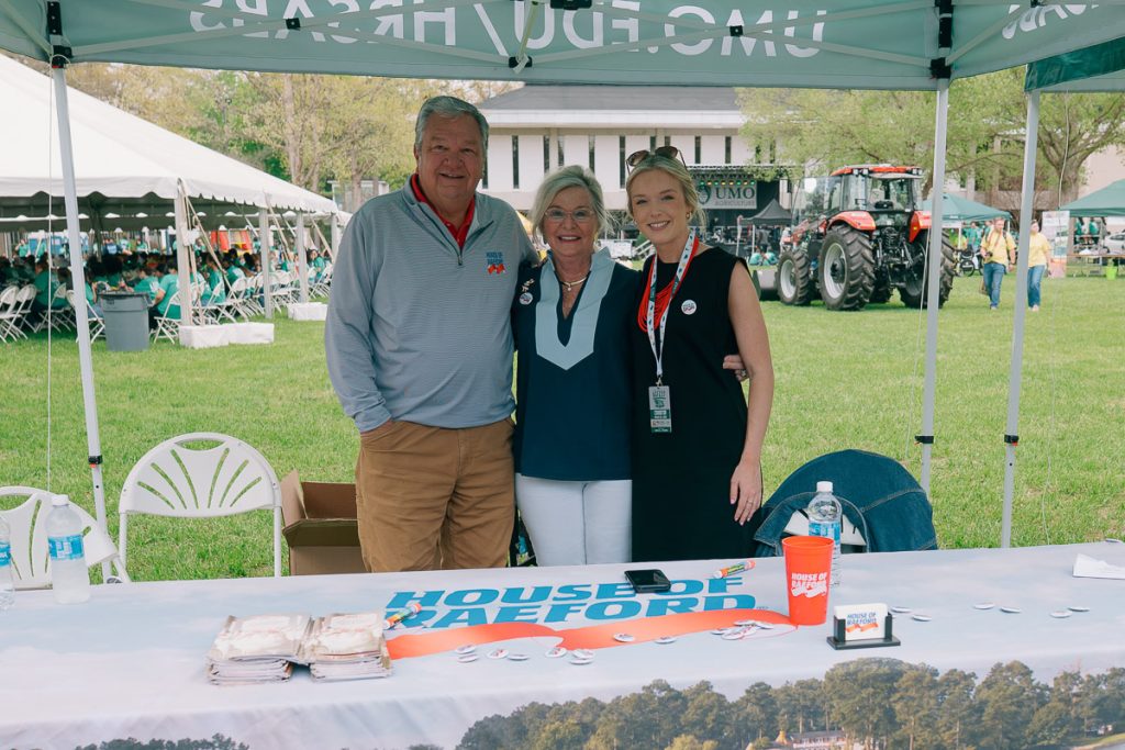 Group from House of Raeford Farms standing in front of their table at UMO 2026 AG Fest.
