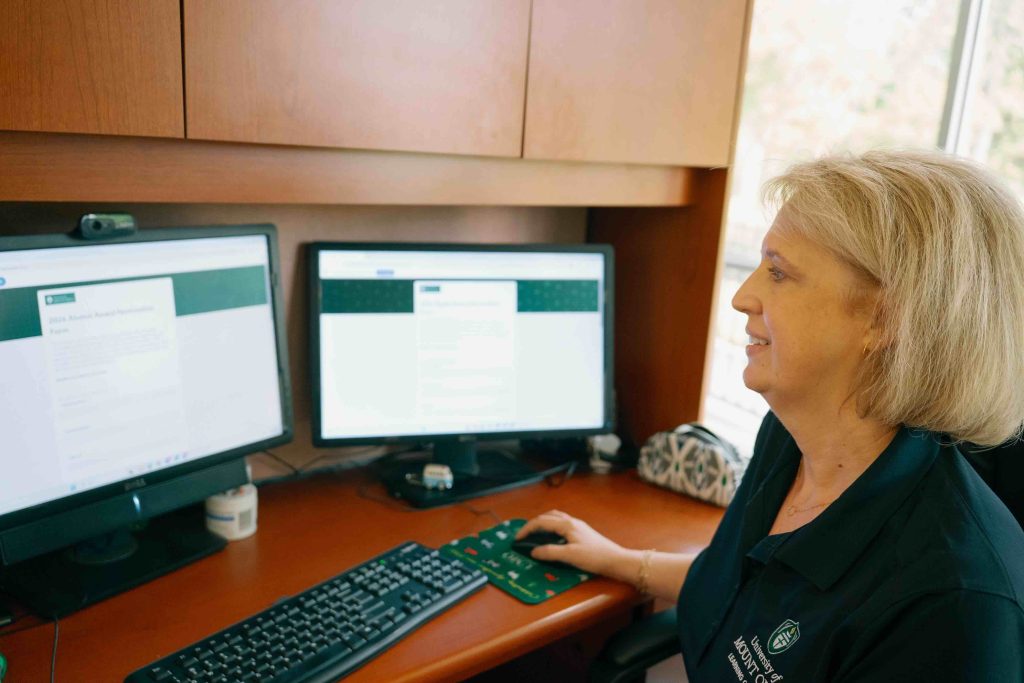 UMO Employee sitting at her desk